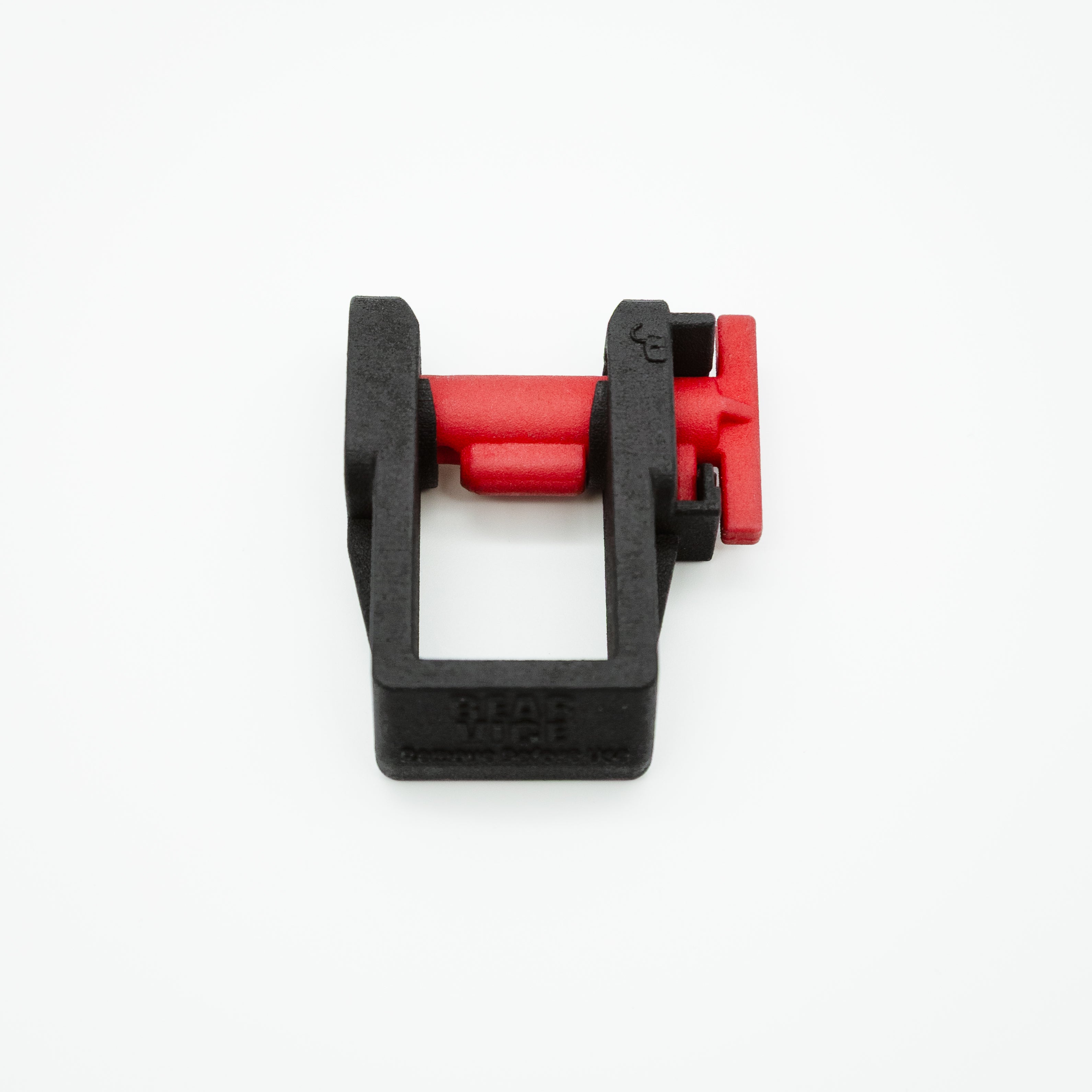 A black and red plastic mechanical component or accessory, photographed on a clean white background.