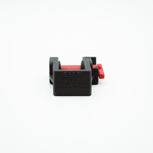 A black plastic quick-release thumb stud with a red release button, branded 'BEAR VICE' on the front, shown on a plain white background.